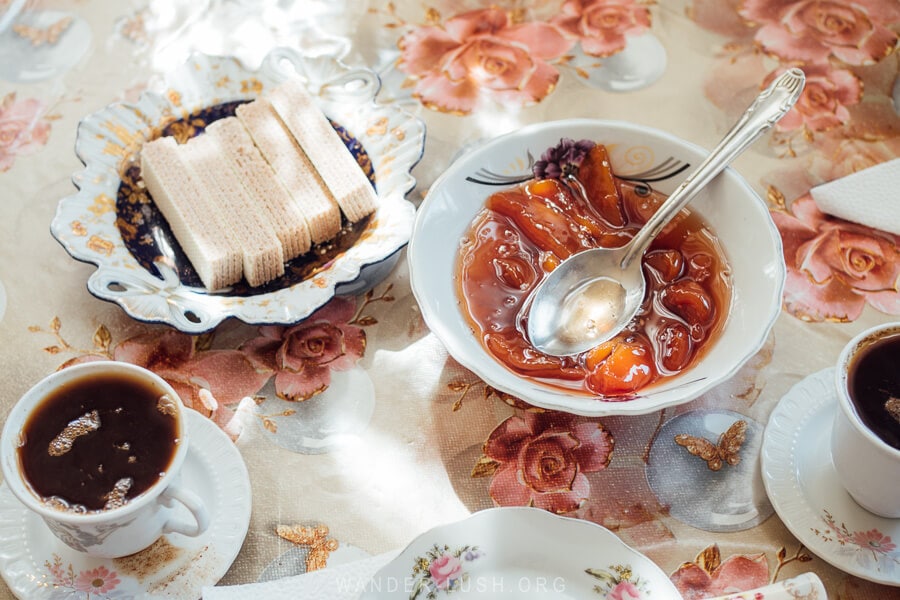 Muraba and other sweets and biscuits laid out for guests in a family kitchen in Georgia.