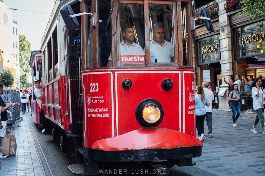 Taksim historic red tram on Istiklal Street in Istanbul.