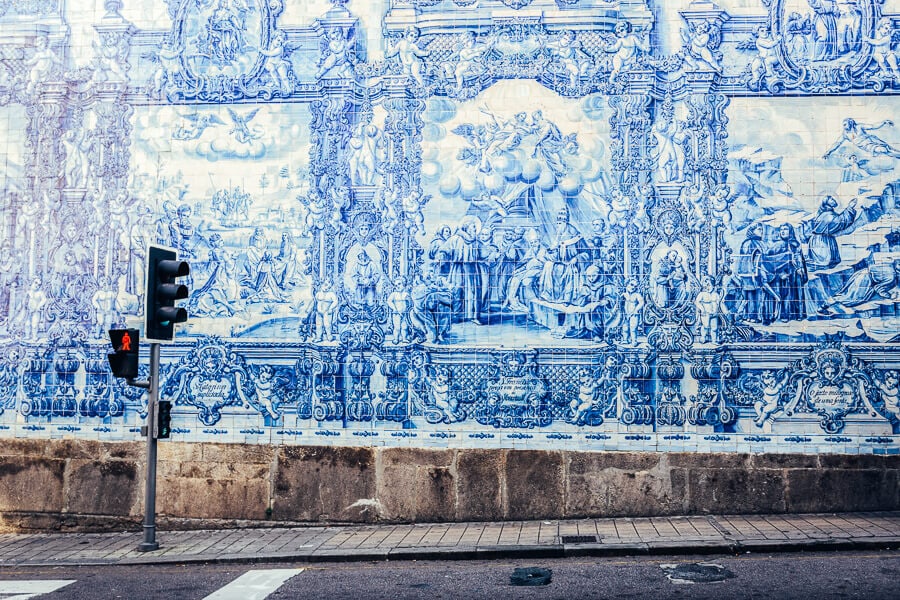 Blue and white ceramic tiles adorn the facade of the Capela das Almas in Porto, Portugal.