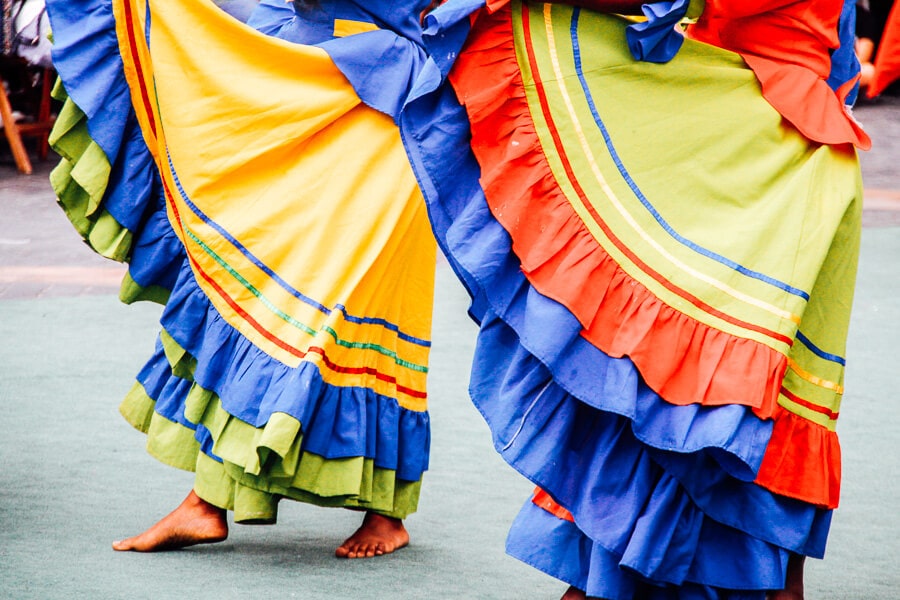 Two women dressed in Colombian La Pollera Colora.