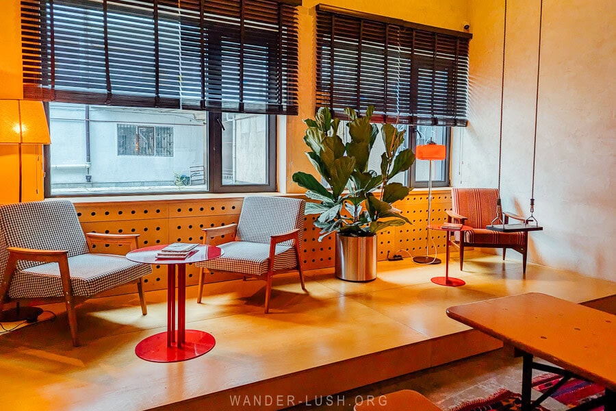 A contemporary hotel lobby in Kutaisi with trendy furniture.