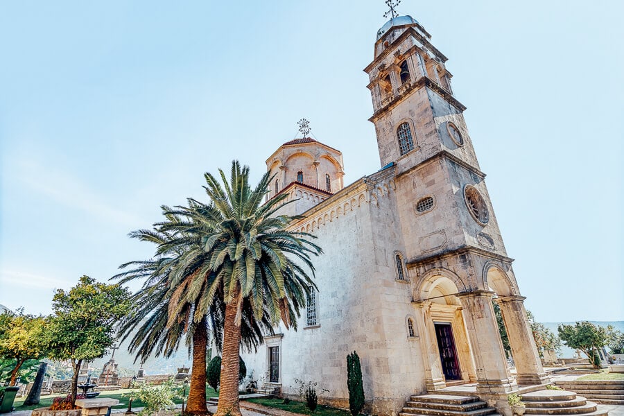Savina Monastery near Herceg Novi, a Serbian Orthodox church fringed by palm trees.