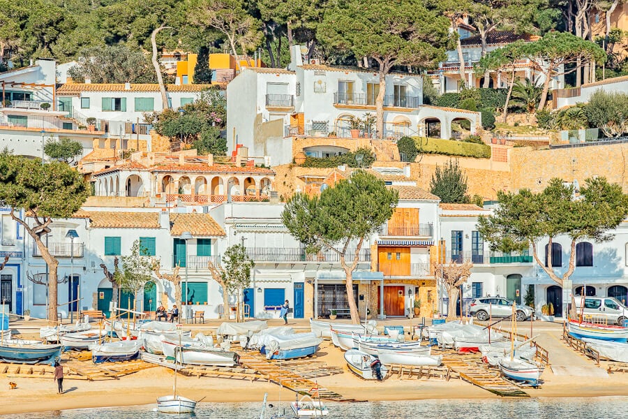 Colourful houses and fishing boats in Llafranc, one of Spain's most romantic coastal towns.
