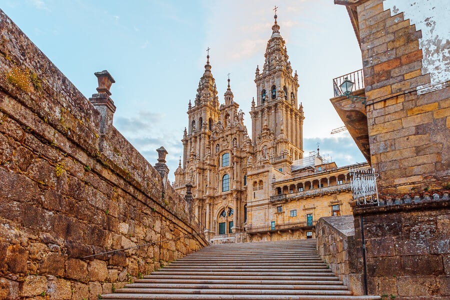 Stone stairs lead to the Santiago de Compostela Cathedral, a pilgrimage spot and beautiful destination in Spain for couples.