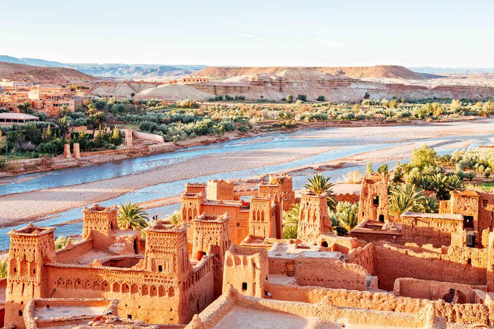 Earthen ruins at Ait Ben Haddou, with the river basin and palm groves in the distance.