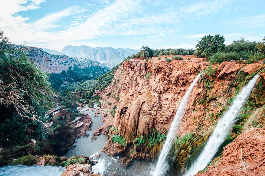 The Ouzoud Falls cascading down a red earth cliff in Morocco.