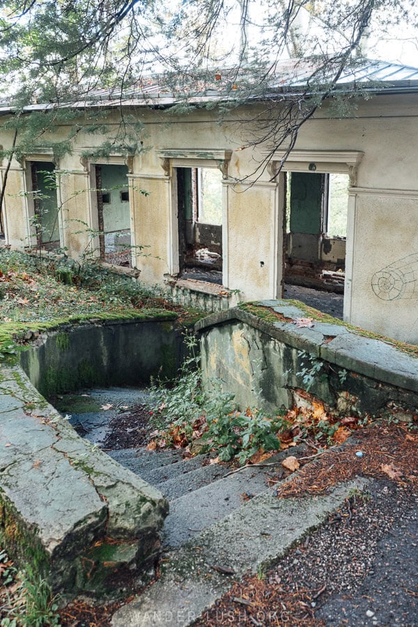 A flight of concrete steps leads down to an abandoned summer house in Tskaltubo, Georgia.