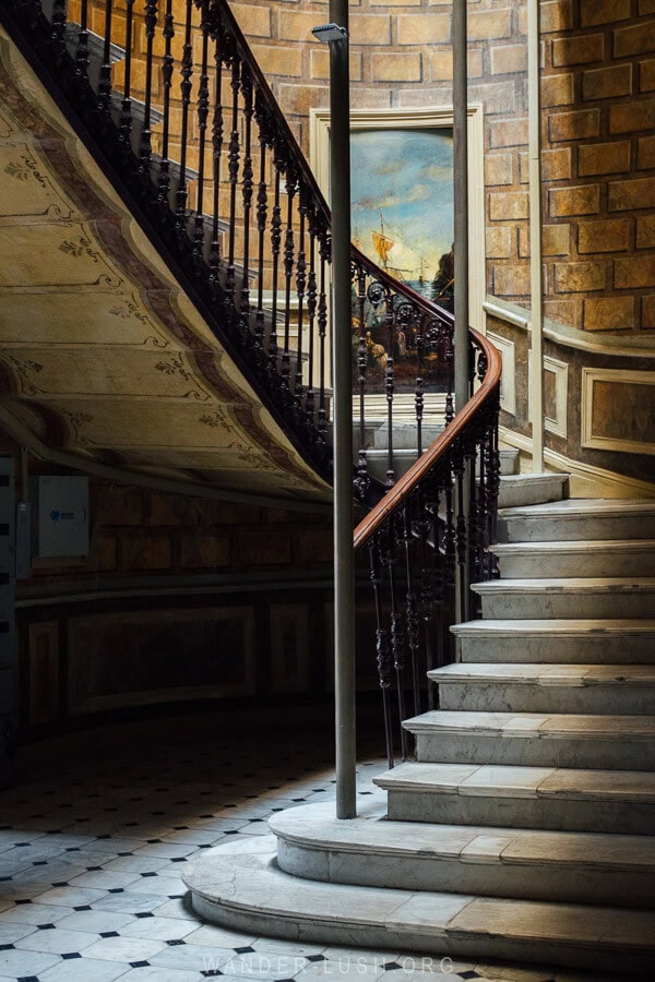 A restored stairwell with a wrought iron staircase inside the former Hotel London in Tbilisi, Georgia.