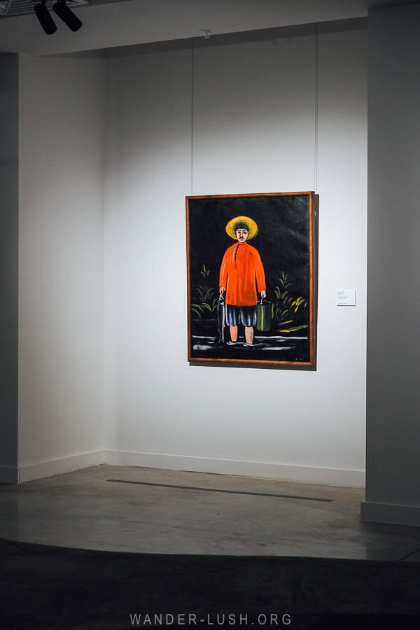 Fisherman in a Red Shirt, an iconic painting by Niko Pirosmani, hanging at an art gallery in Tbilisi.