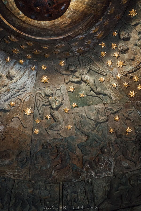 Sculptural panels inside The Apple of Love by Georgian artist Zurab Tsereteli depict different Biblical inspired images.