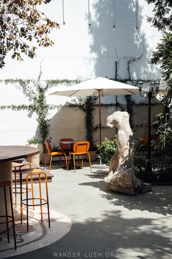 A beautiful courtyard with a sculpture in a cafe in Tbilisi.