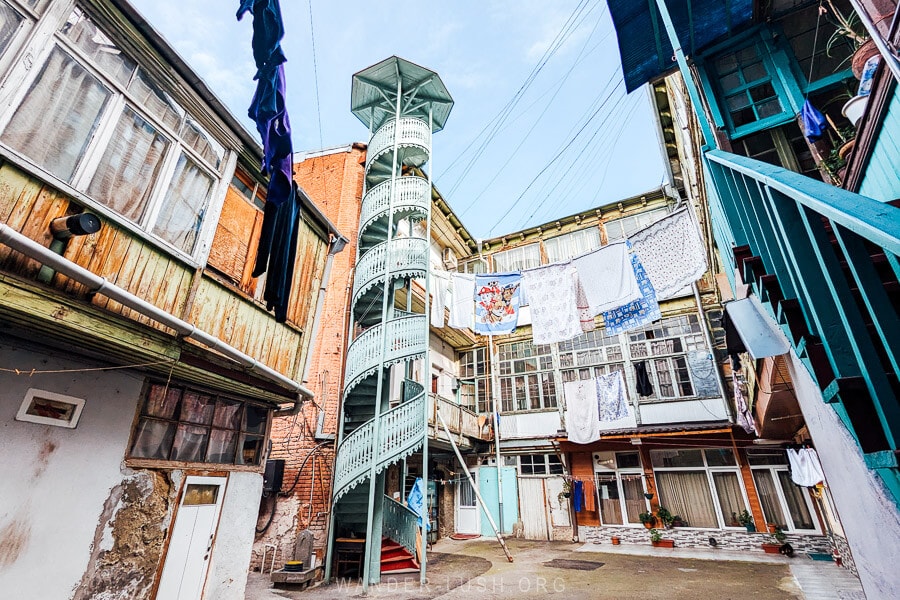 An iconic Tbilisi Courtyard in Vera district of Tbilisi, with a blue staircase.