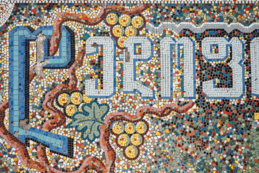 A mosaic road sign marks the entrance to Dedoplistskaro in Georgia.