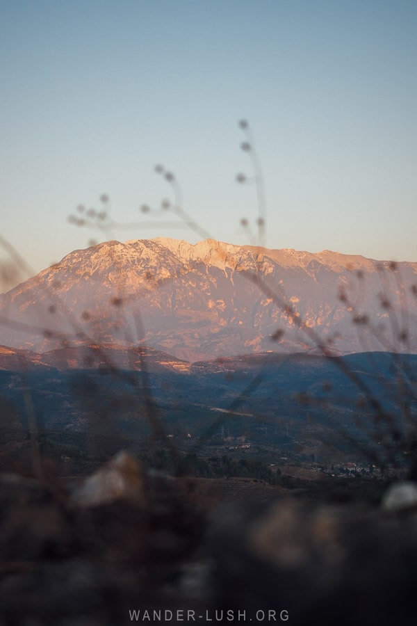 View of a purple mountain at sunset in Berat.