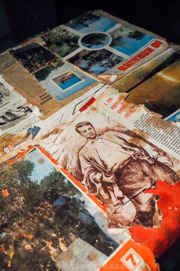 Old propaganda materials on a desk inside the Gjirokaster bunker museum.