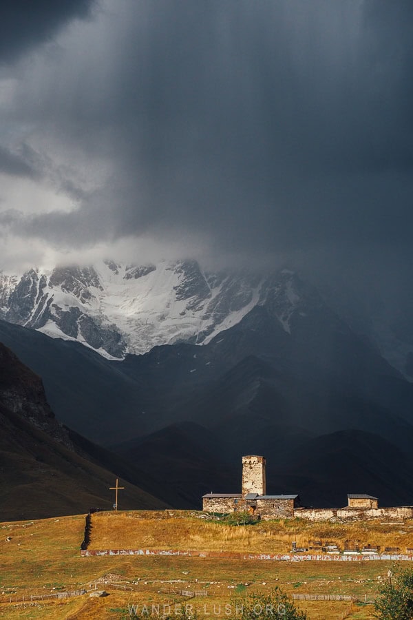 Lamaria Church in Ushguli under a stormy summer sky.