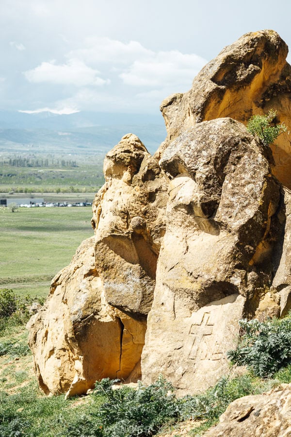 A cross carved into stone on the site of the Kartli Burial Tombs in Georgia.