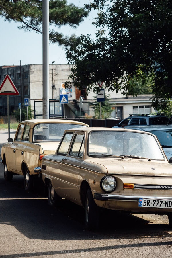 Vintage Lada cars parked in a small town in Georgia.