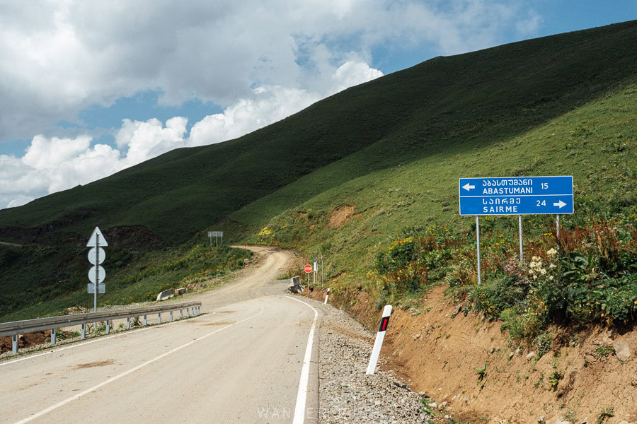 A sign points towards Abastumani and Sairme from the top of the Zekari Pass in Georgia.