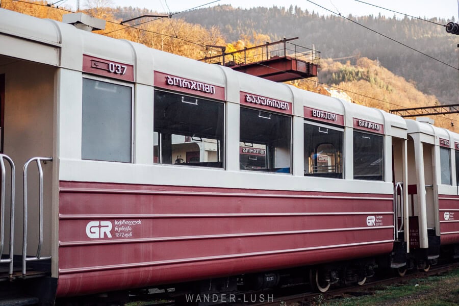 A red and white train carriage on the Kukushka historic railway from Borjomi to Bakuriani in Georgia.