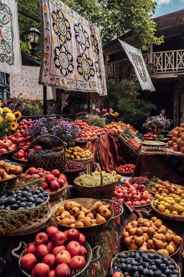 Baskets and bowls of pears, plums and apples and grapes arrange in the yard at Georgian House restaurant during the Tbilisoba festival.